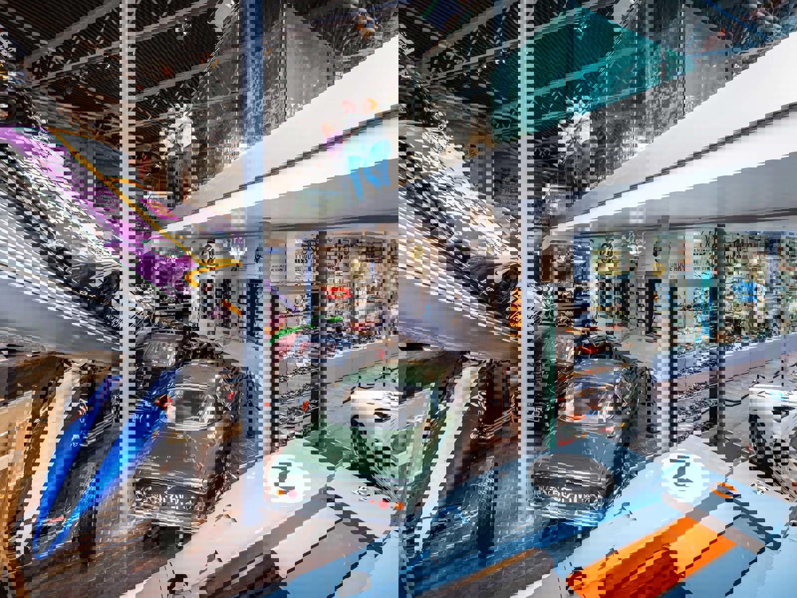 Museum Visitors On Mezzanine floor looking out over the museum