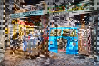 Entrance to the Streets Ahead gallery with blue Morris Commercial vehicle in foreground