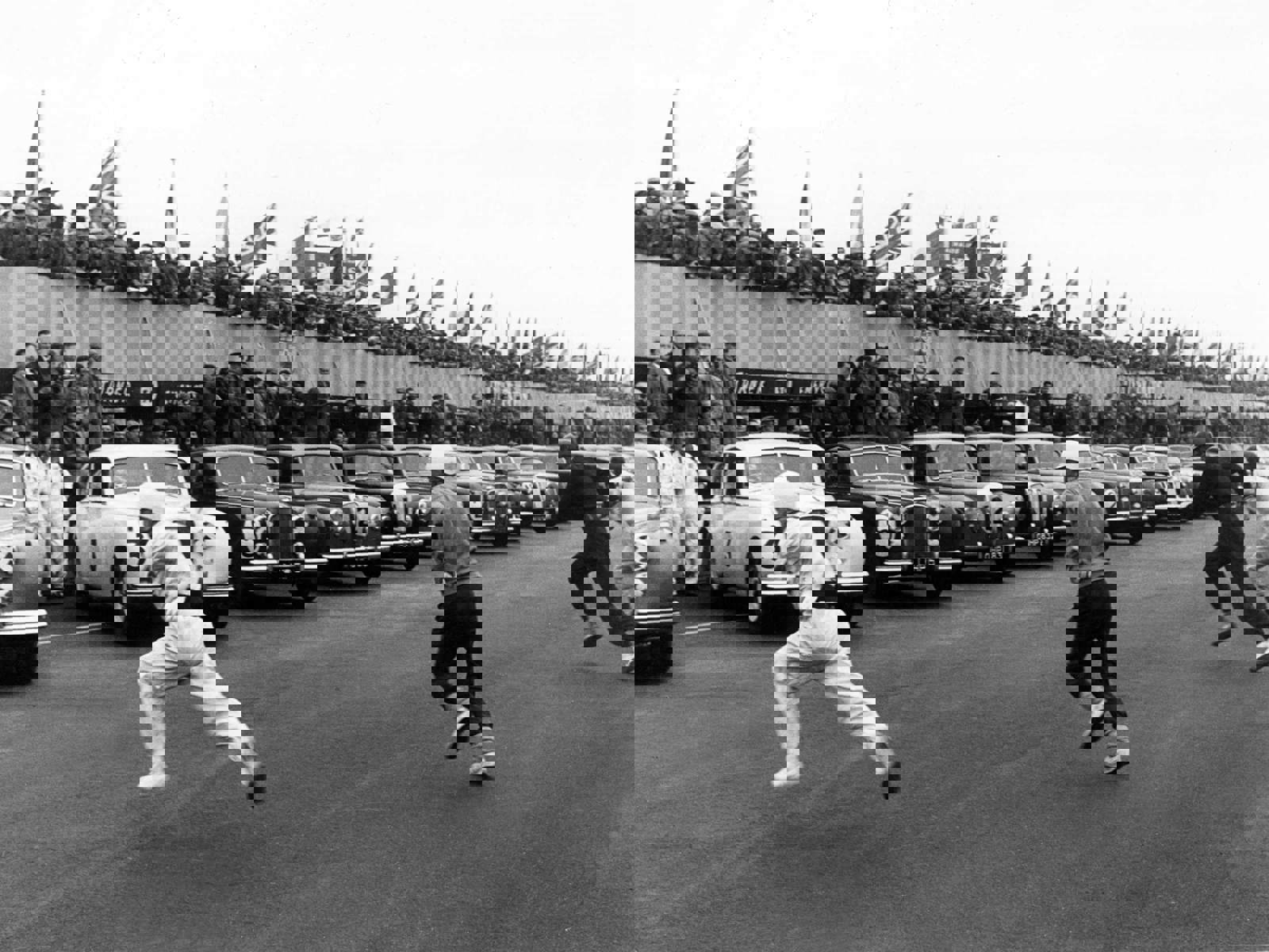 Archive image c1960s of race cars on track with drivers running to their cars