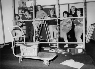 Group of people moving the National Motor Museum library from JMB to Trust Centre 1989