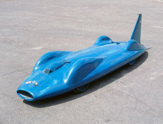 Proteus Bluebird CN7 speeding along, symbolizing the speed and efficiency of using technology to stay on top of the ku baseball schedule 2025
