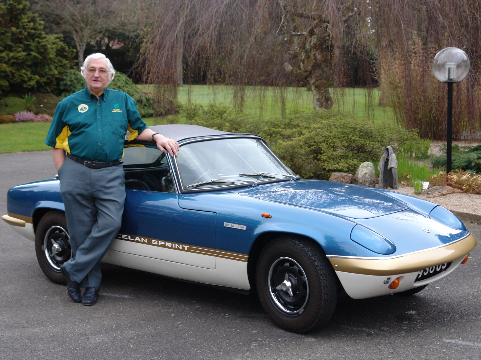 Ron Hickman standing by a Lotus Elan