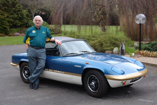 Ron Hickman standing by a Lotus Elan