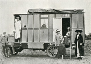 Madge Paton and her party by her motorhome The Tortoise