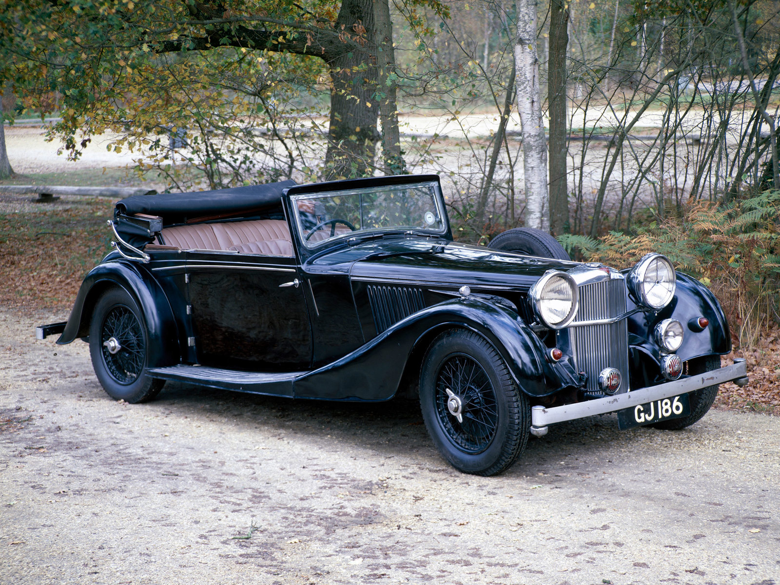 A 1937 Alvis Speed 25 in a woodland setting