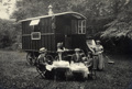 Caravan Club member Grace Simmons and her party seating at a table in front of her caravan