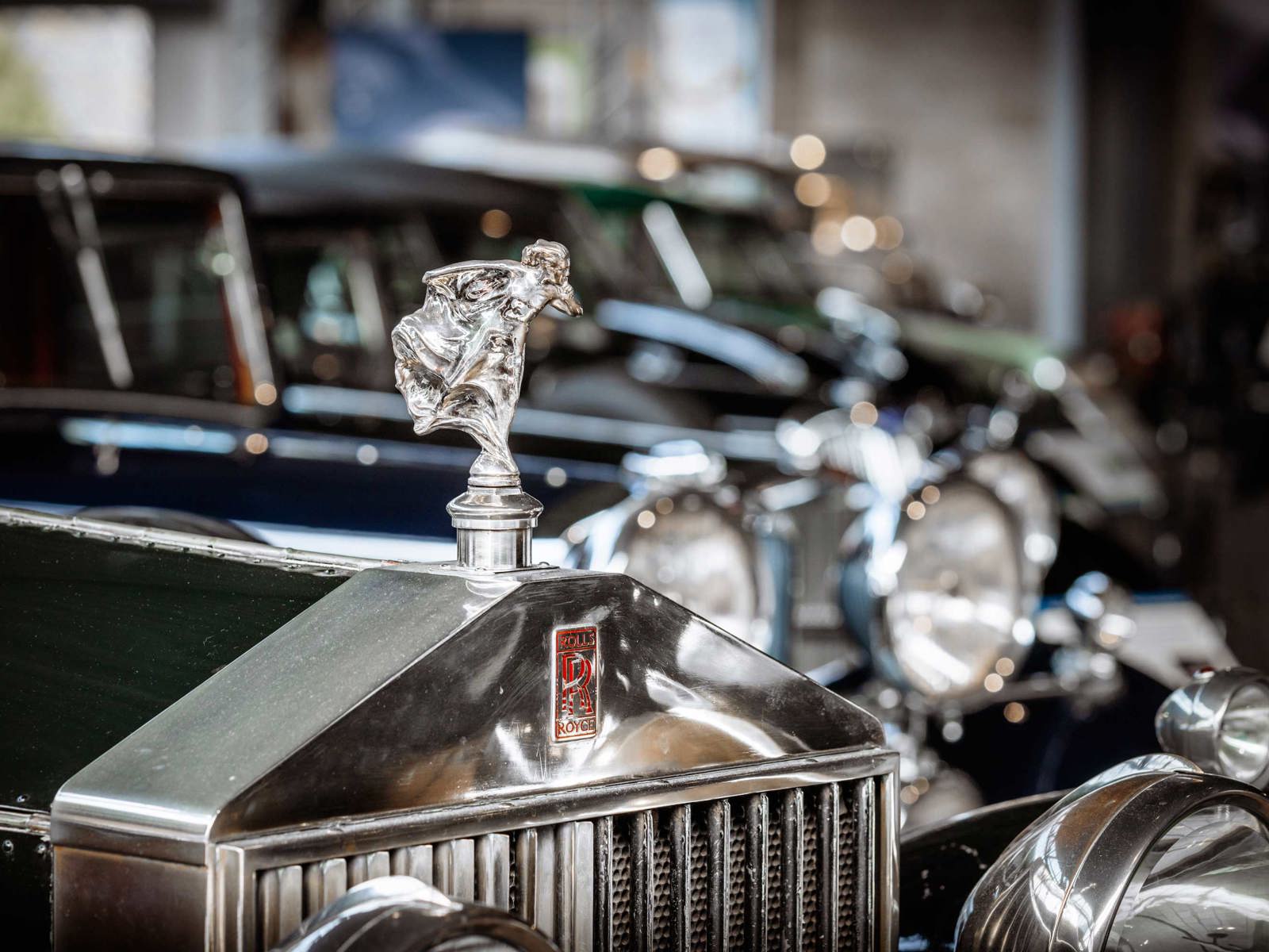 close up of the Rolls Royce whisperer car mascot