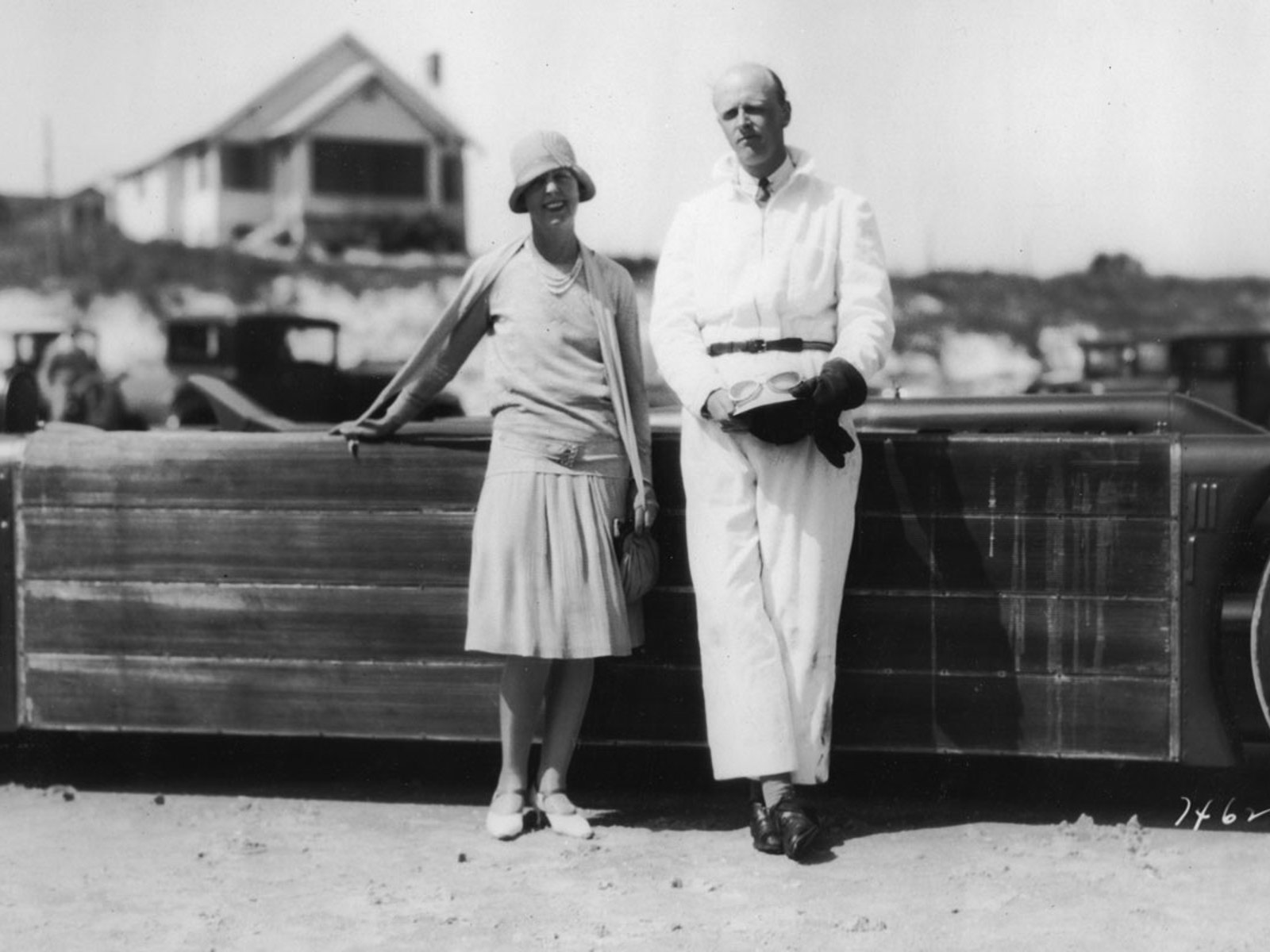 Doris Stocker and Henry Segrave standing by his car