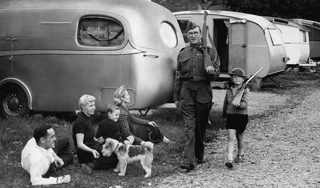 Homeguard patrolling in a caravan colony
