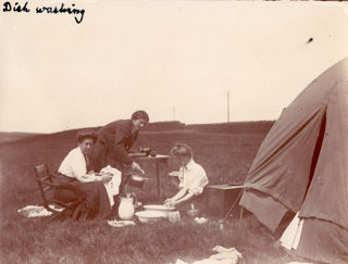 Three ladies doing daily chores during a NUWSS caravan tour
