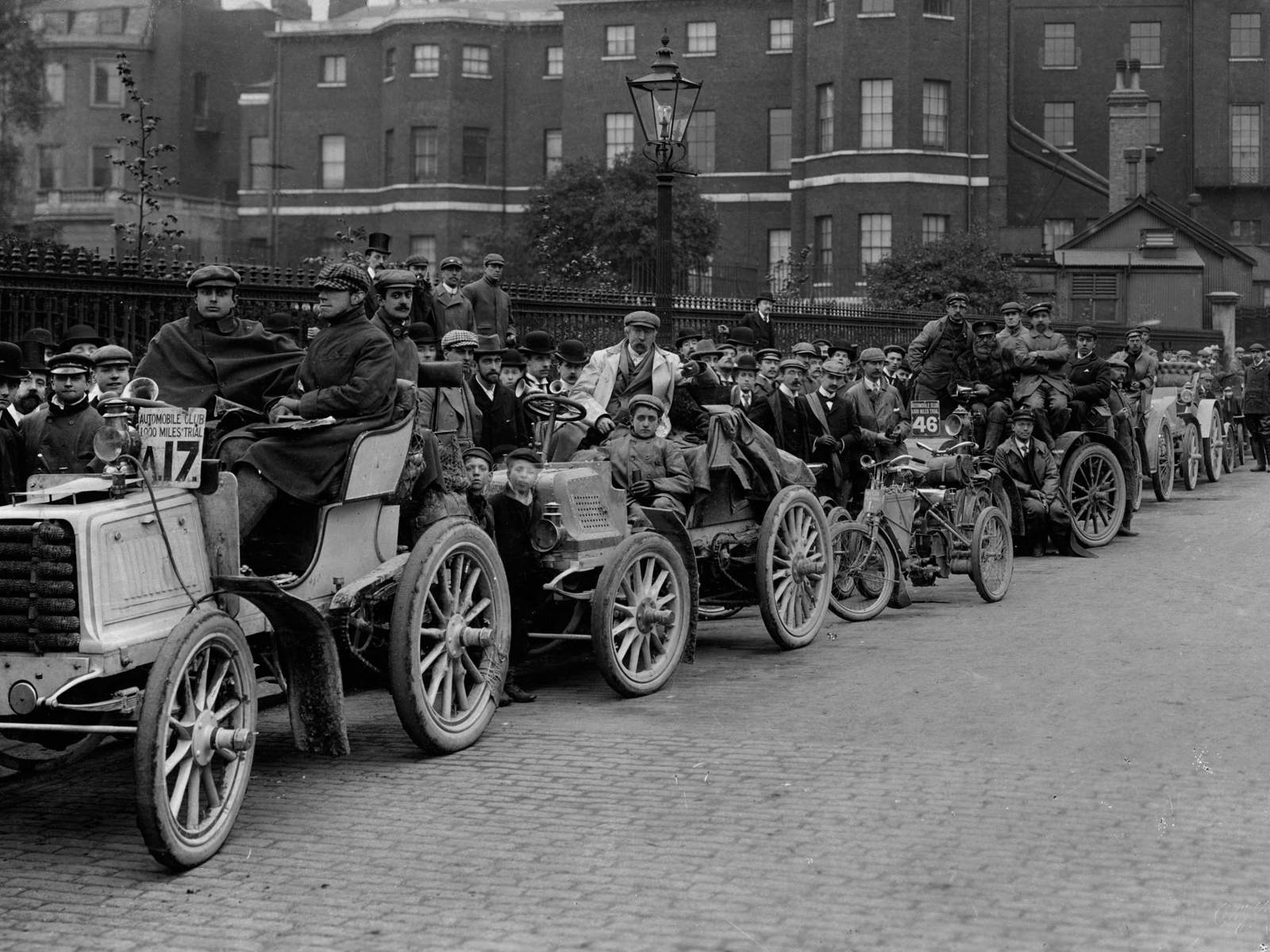 archive early motoring picture of the 1000 mile trial with veteran vehicles in a line