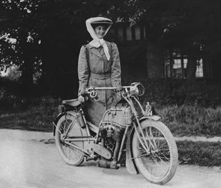 Miss Muriel Hind standing by her Rex motorcycle in 1909