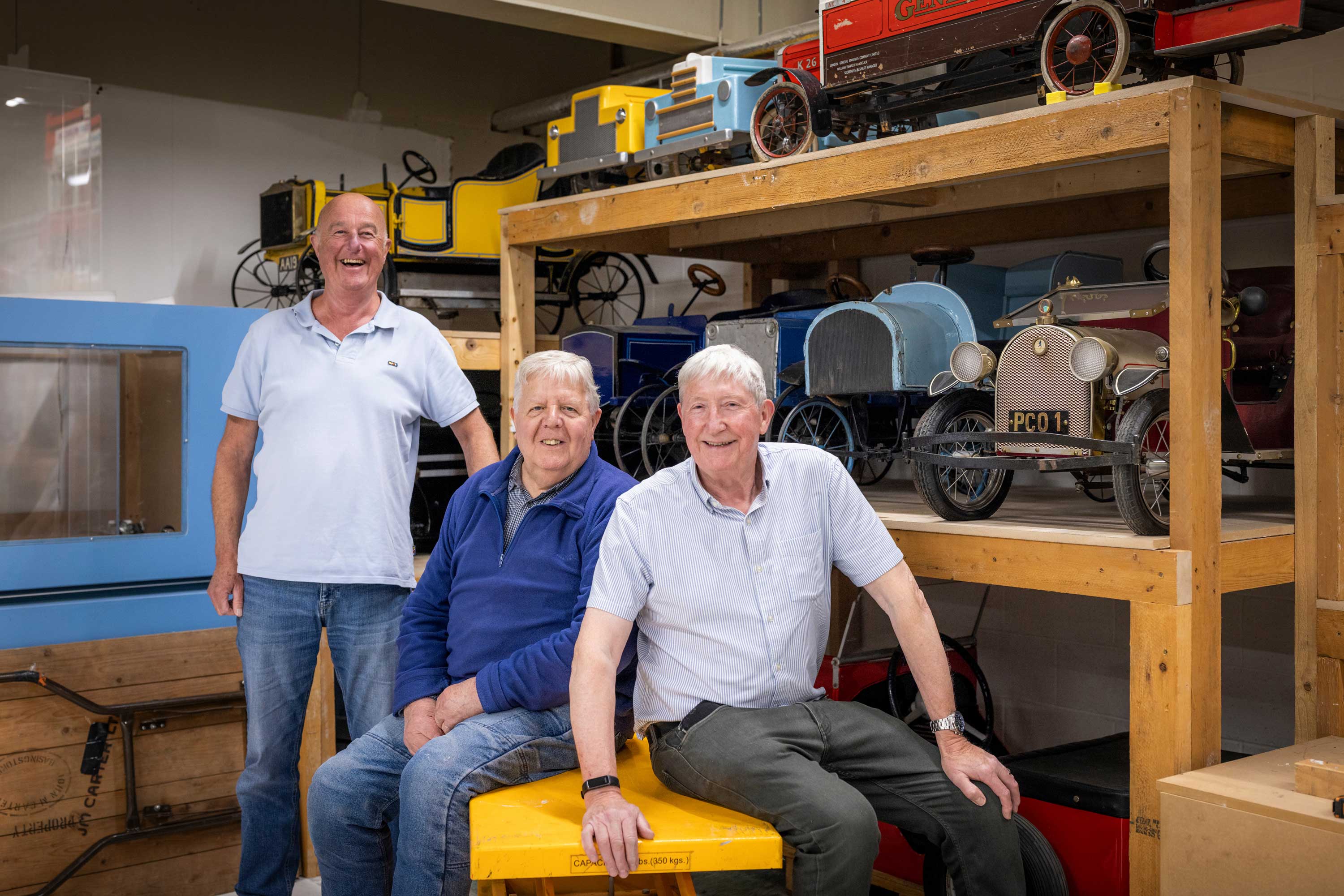 three male volunteers in objects store