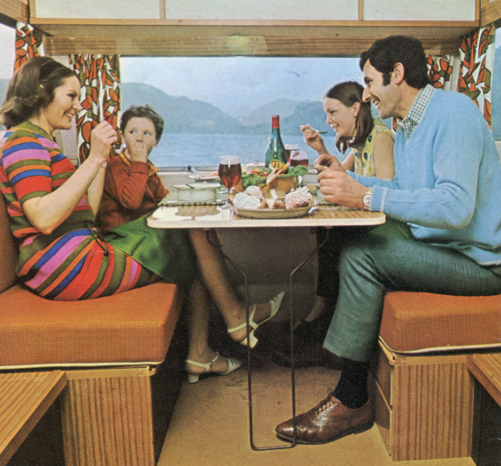 Advert shot of a family having lunch in a Sprite caravan