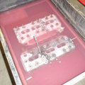 Parts of the Sunbeam 1000hp engine immersed in cleaning solution