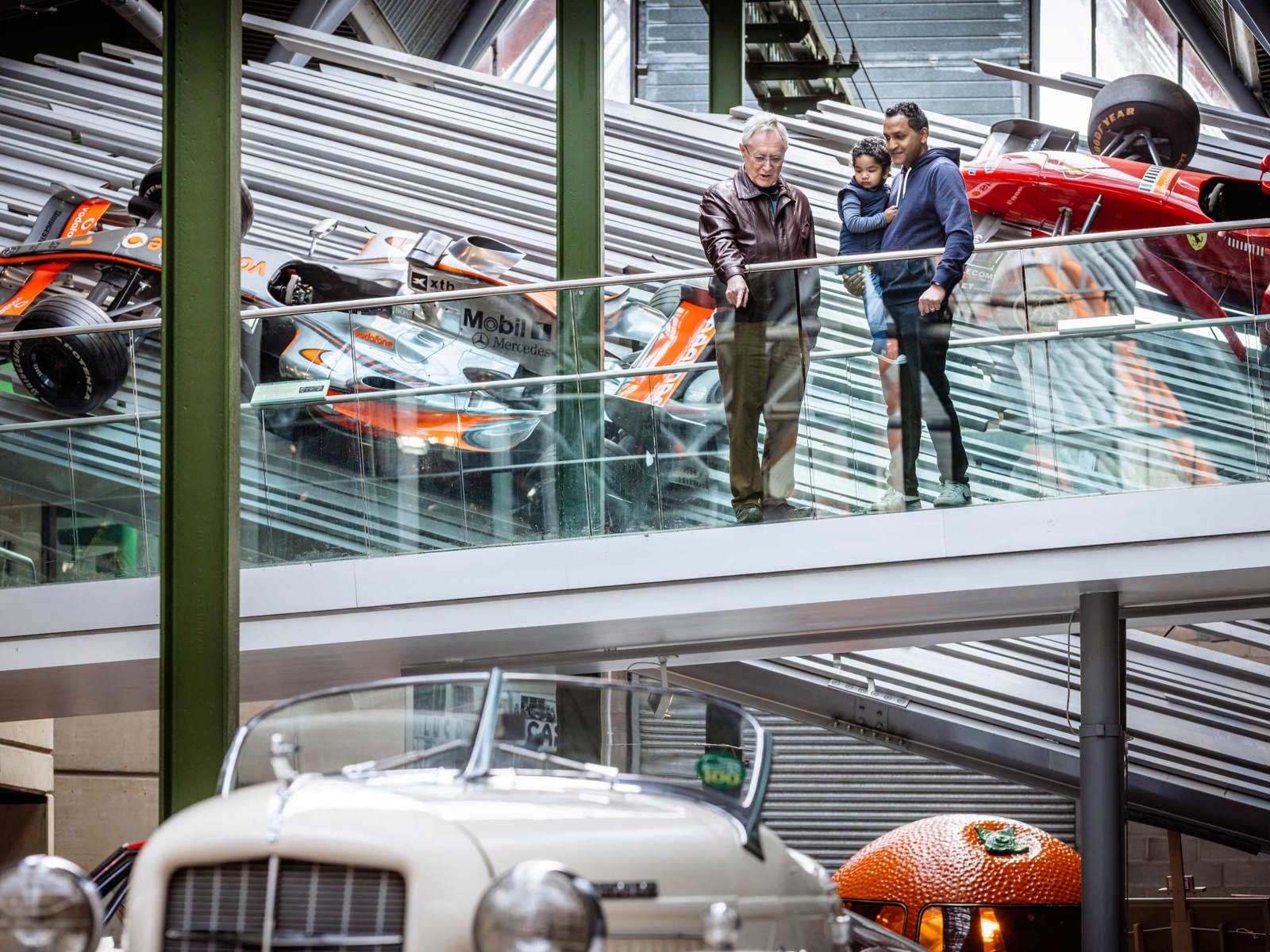 Family on the bridge to the Mezzanine in the National Motor Museum