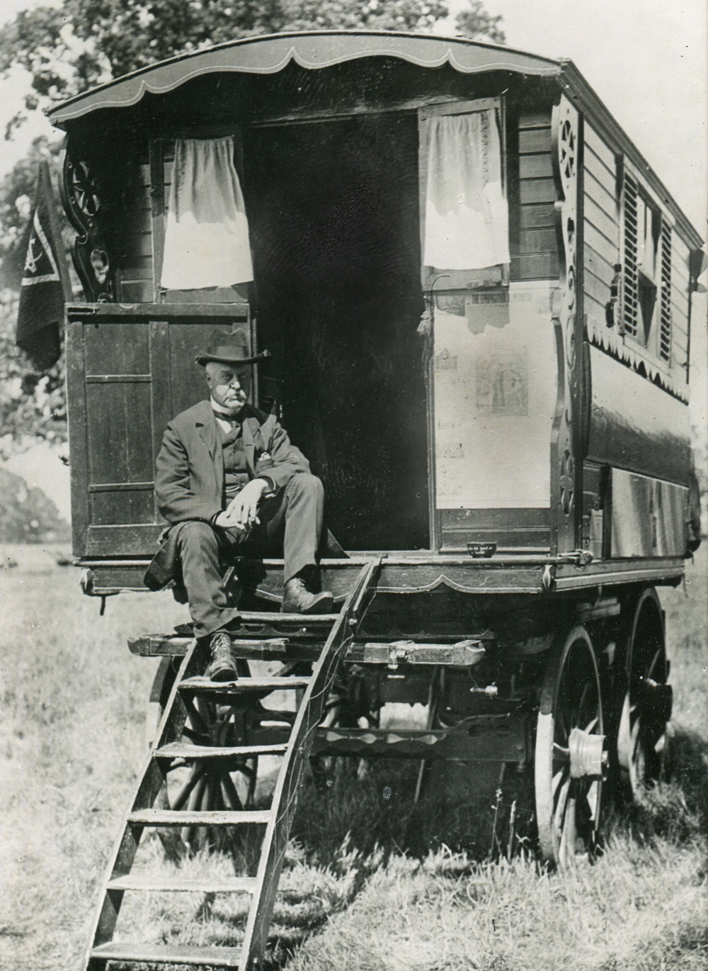 Founder of The Caravan Club J Harris Stone sitting on the doorsteps of his caravan