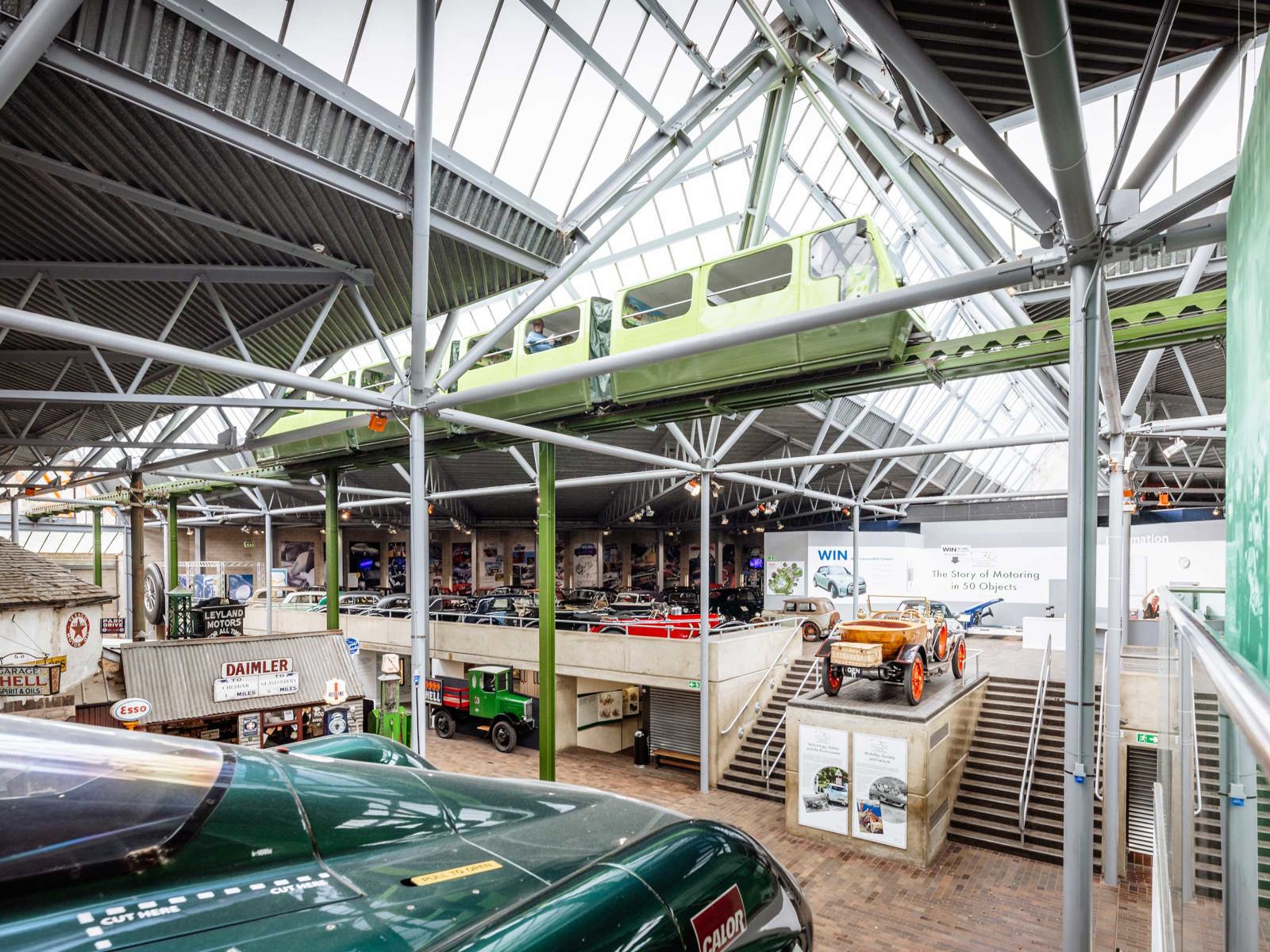 Panoramic view of the National Motor Museum with monorail passing overhead