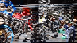 Family group looking at motorcycles in the National Motor Museum