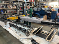 Workshop Engineer Mitch Caws Works On Parts Of Sunbeam's Second Engine Laid Out In The National Motor Museum Workshop