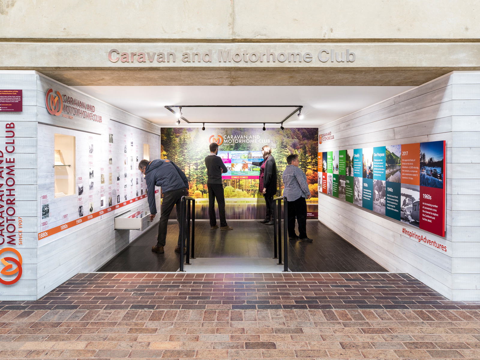 View of the Caravan and Motorhome Club booth at the National Motor Museum with visitors