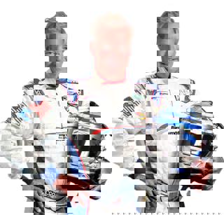 Hurley Haywood holding racing helmet