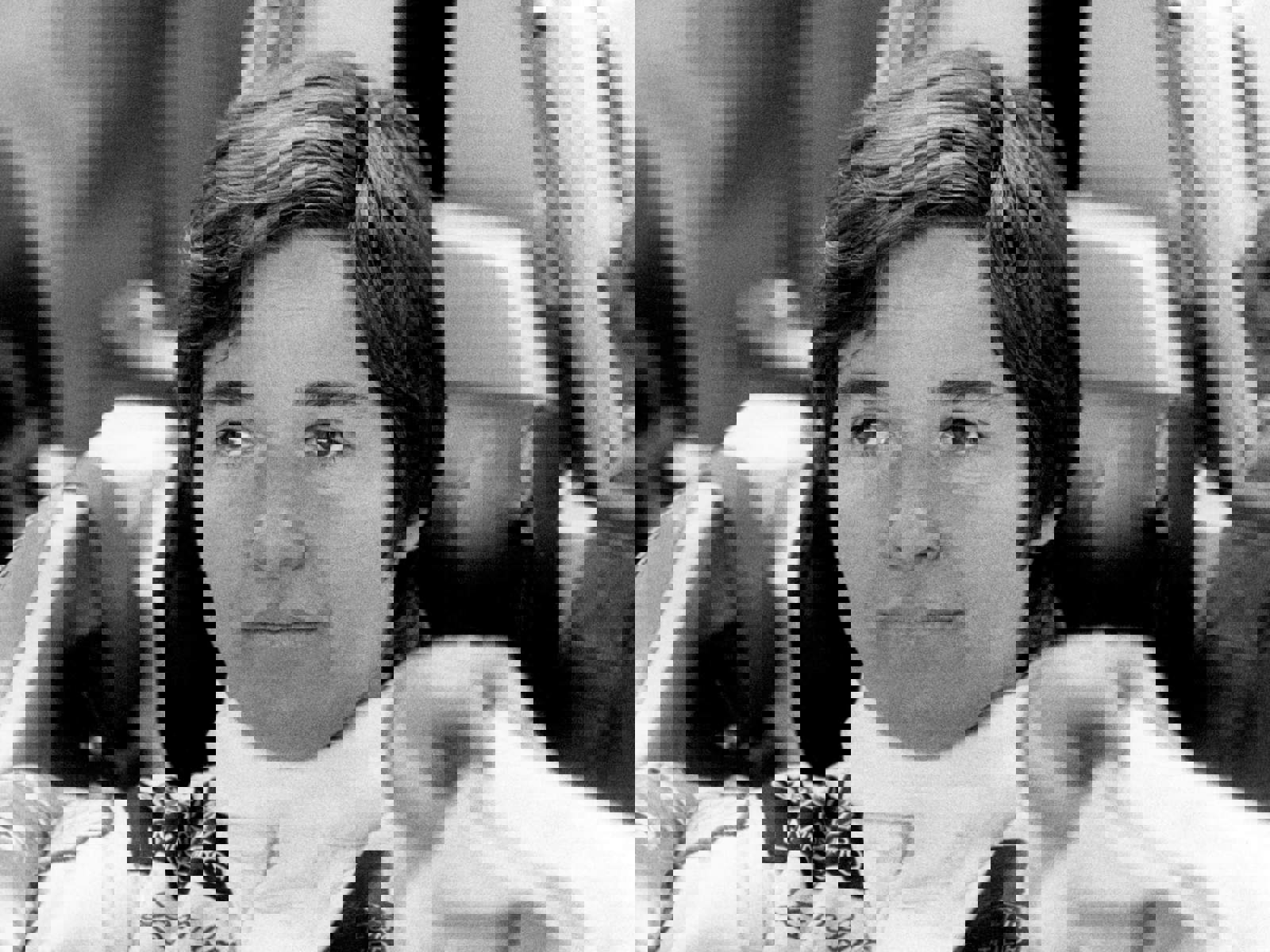 Lella Lombardi seated in racing car