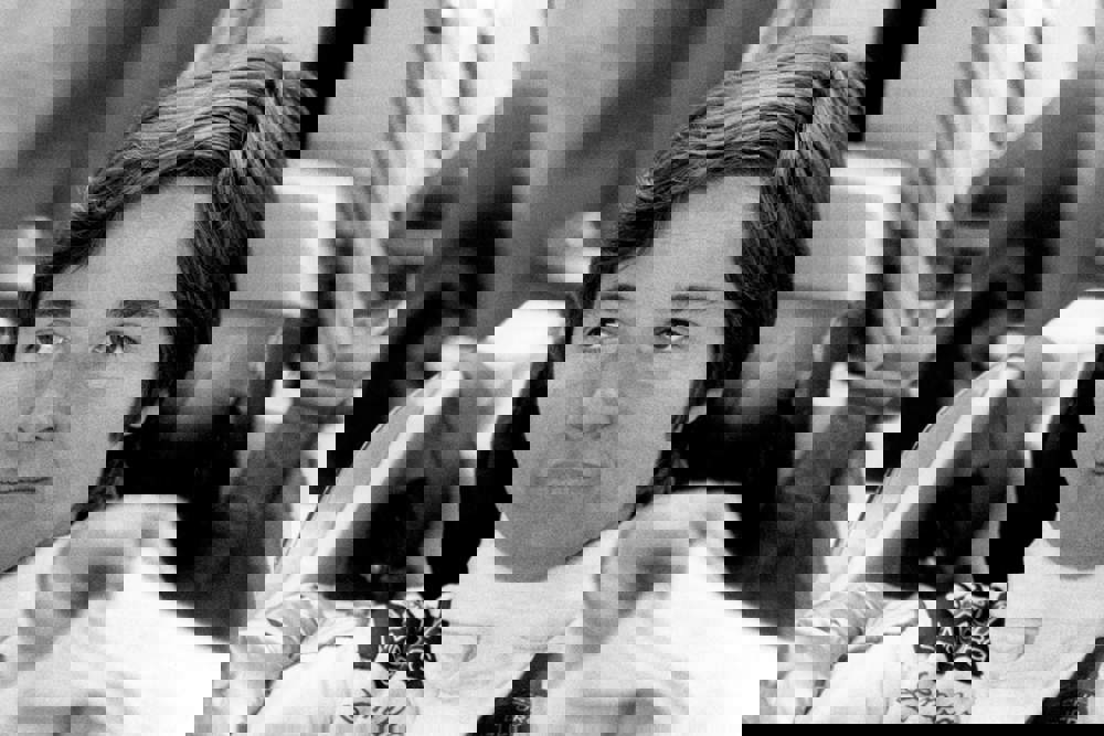 Lella Lombardi seated in racing car