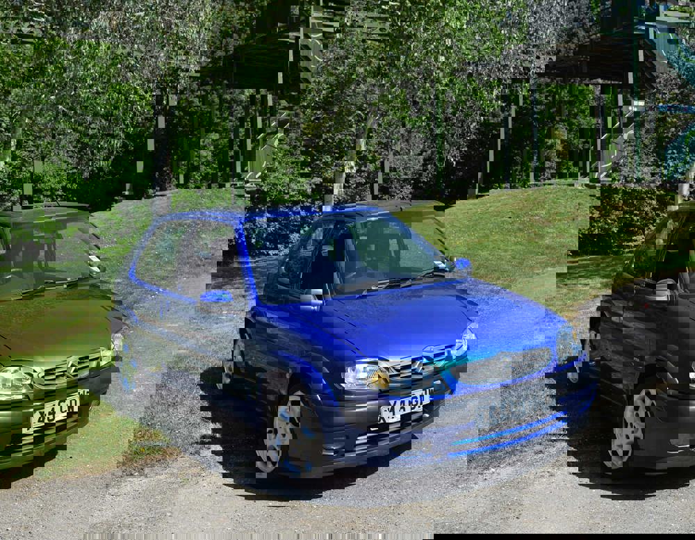 Blue 2000 Citroen Saxo VTS from the Gavin and Stacey BBC series. Pictured in front of the monorail at the National Motor Museum.