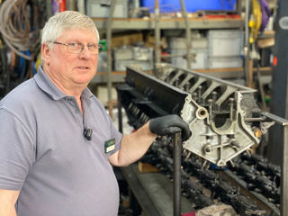 Senior Engineer Ian Stanfield With Rear Engine Crankcase In Workshop