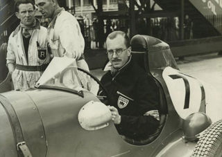 Hugh Hunter sitting at the wheel of racing car