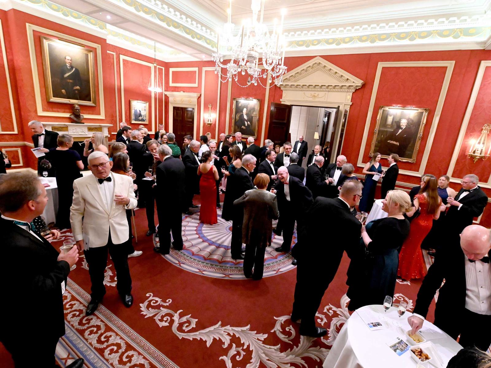 B100 members at a dinner at the RAC club