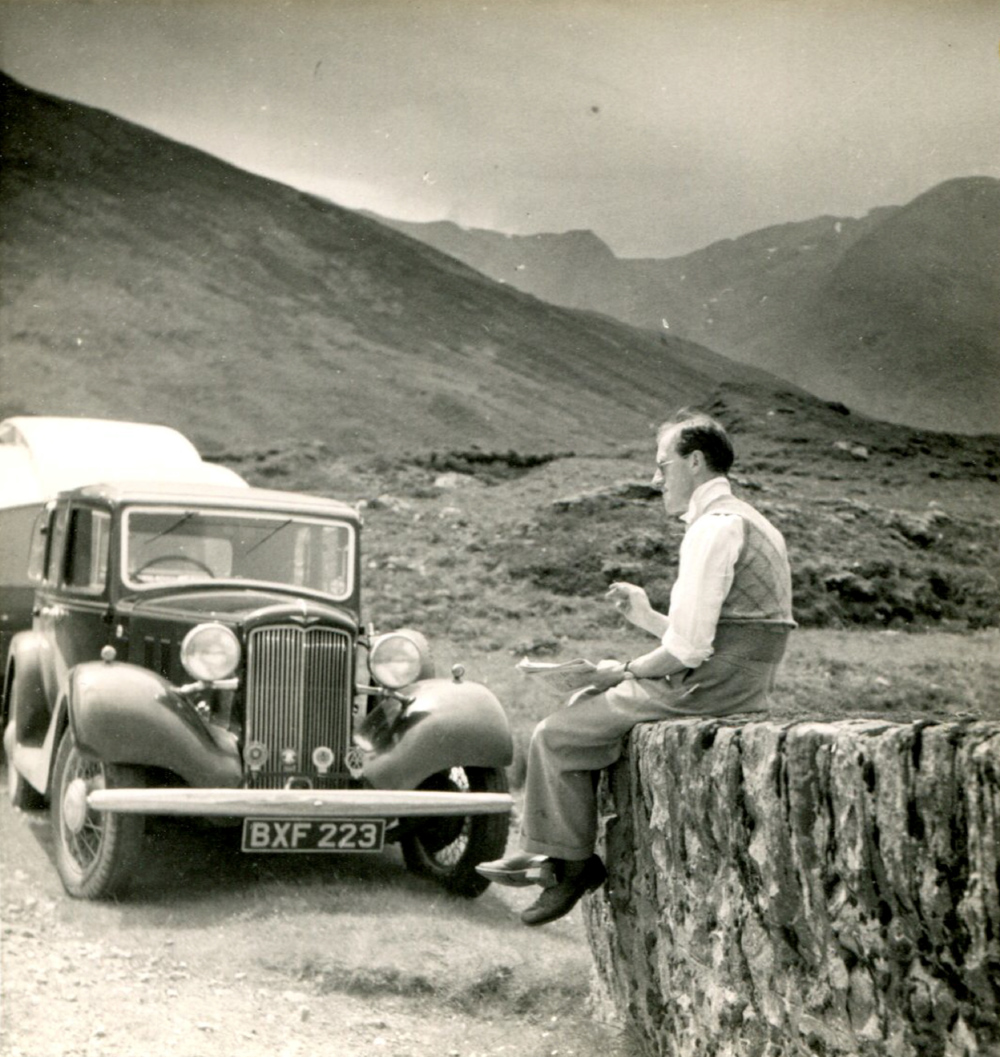 Bertram Hutchings sitting by his caravan in the Western Highlands, in 1936