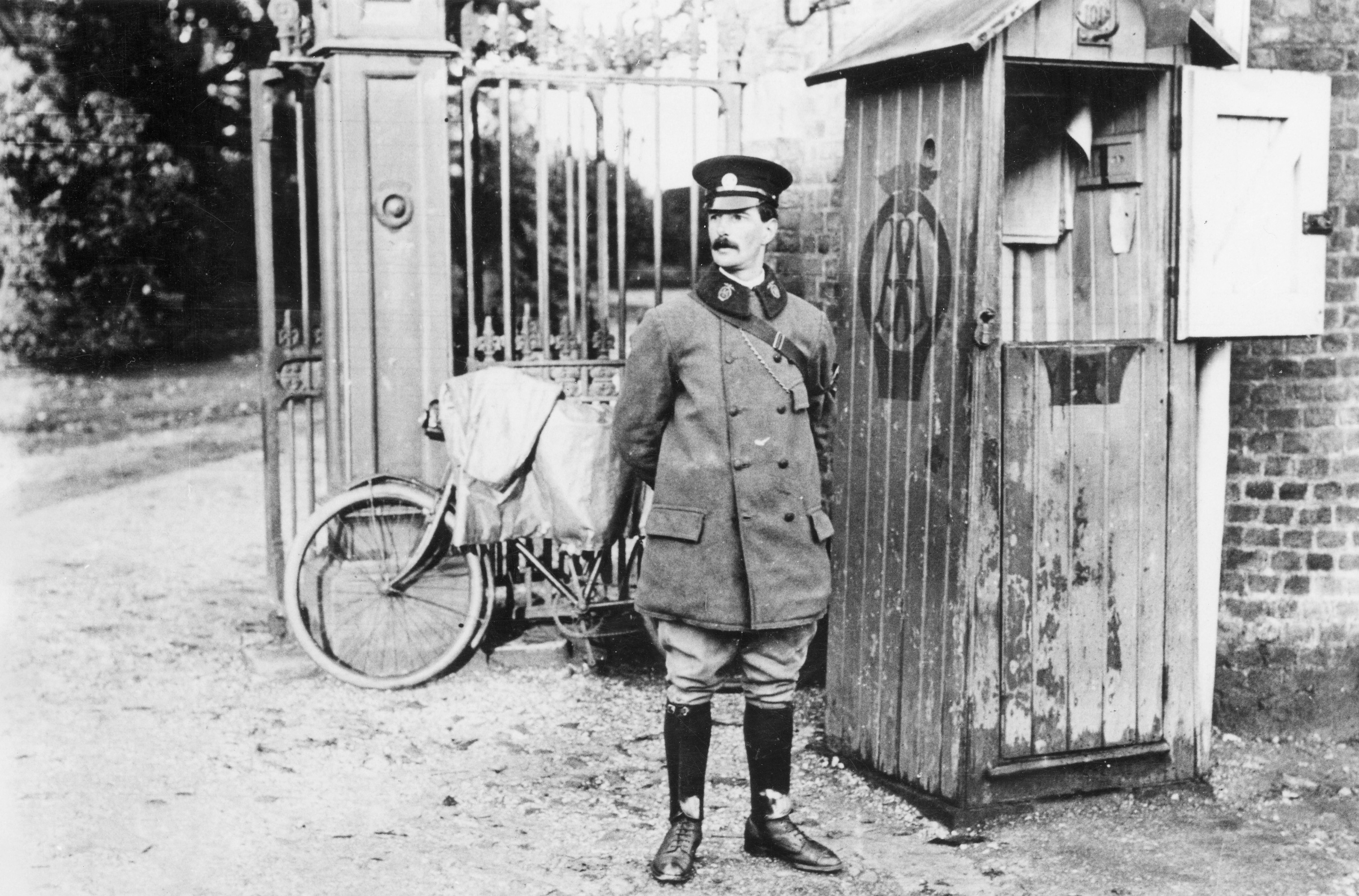 AA Phone Box with man in uniform standing next to it