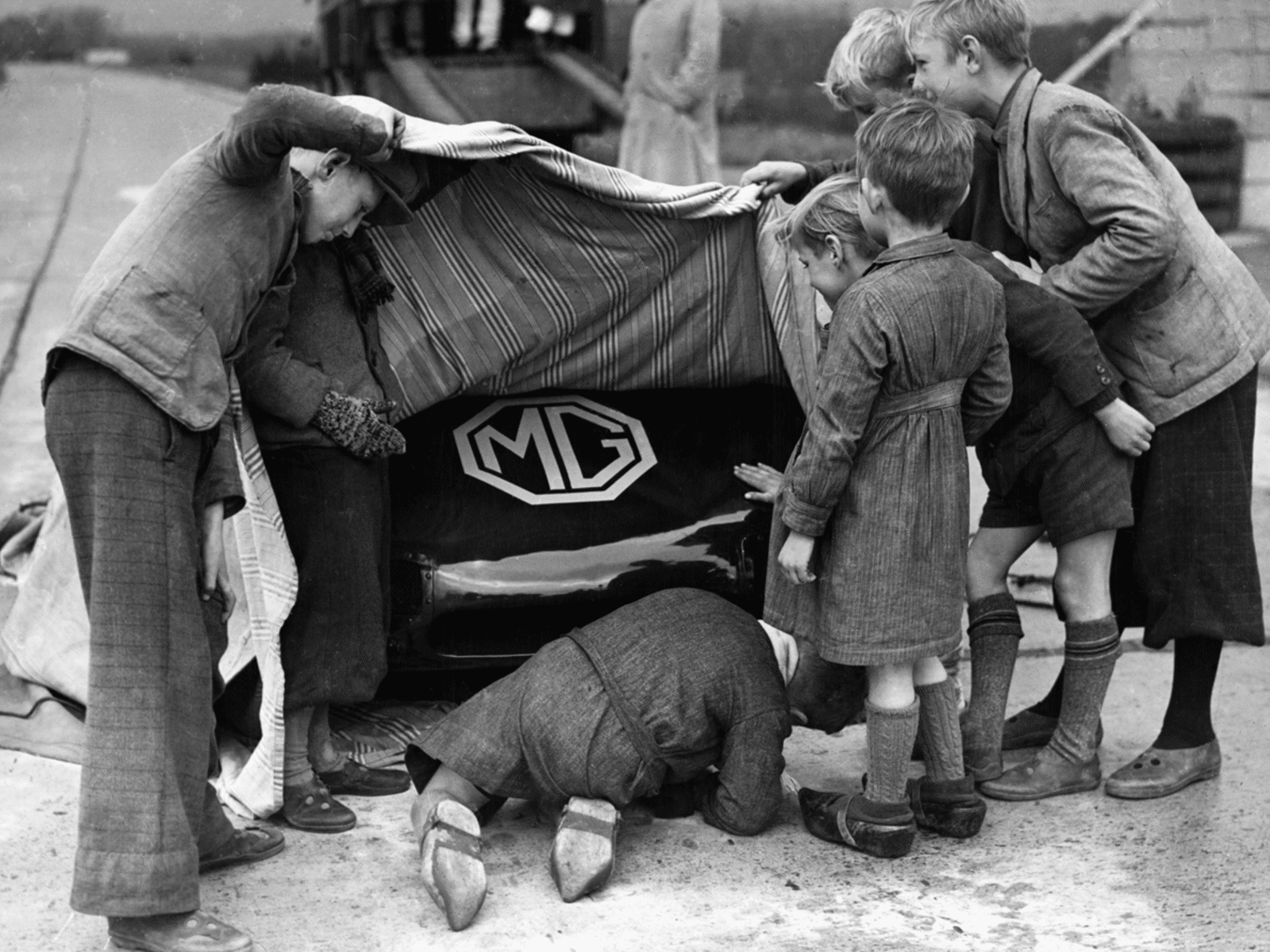 Local children take a quick peek at EX 135 between record breaking runs at Jabbeke, Belgium. Lt. Col. A T Goldie Gardner set numerous class records on the stretch of unfinished motorway near Ostend between 1946 and 1950.