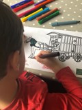 Child colouring a downloadable activity