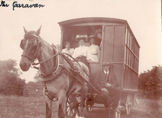 Four Cambridge students during a caravan tour for the NUWSS