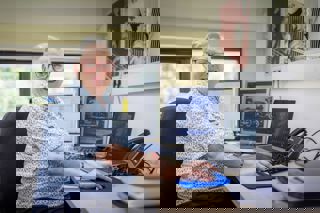 female volunteer at desk with computer