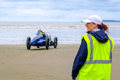 Sunbeam 350hp on the beach at Pendine whilst a Museum staff looks on