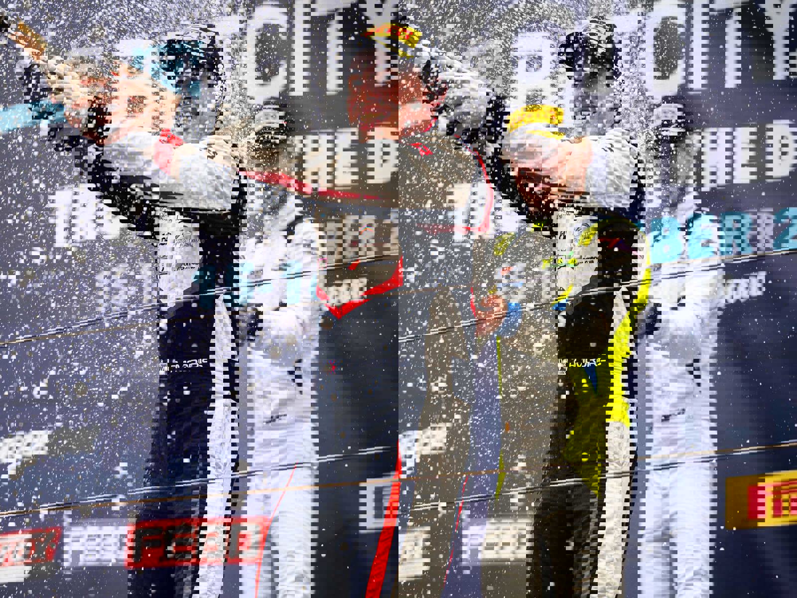 Richard Morris at Zandvoort race track on podium spraying champagne