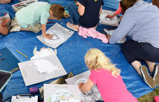 Group of children engaged in a colouring activity