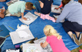 Group of children engaged in a colouring activity