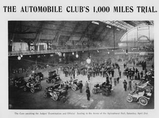 Panoramic view of several vehicles and drivers before the start of the 1000 Miles Trial