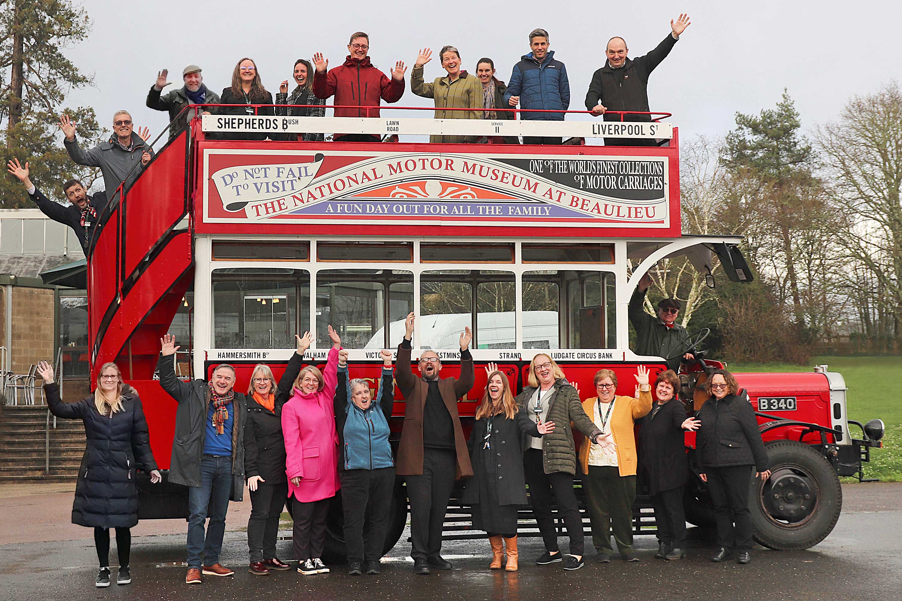 National Motor Museum staff on veteran bus celebrating The Heritage Fund Grant  award