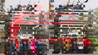 National Motor Museum staff on veteran bus celebrating The Heritage Fund Grant  award