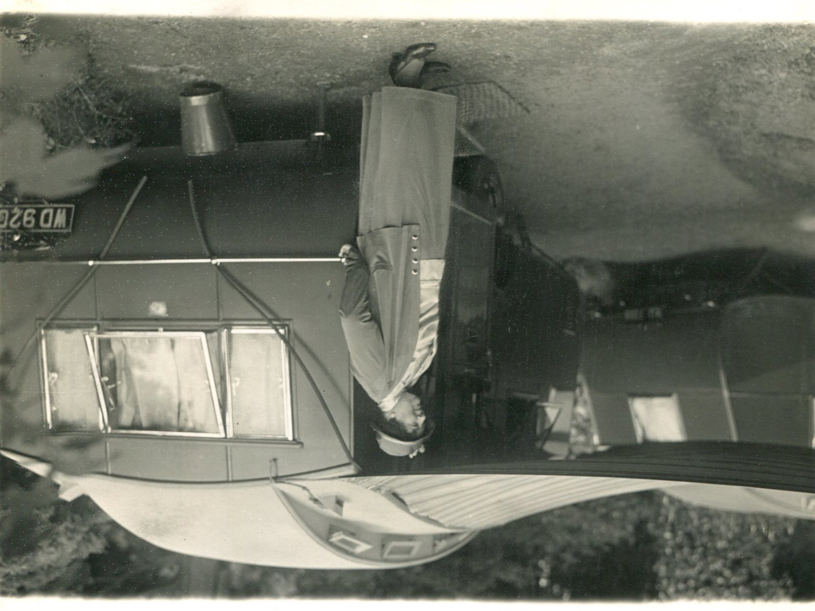 Mrs Fowler next to one of her Eccles Blue Caravans, 1930s