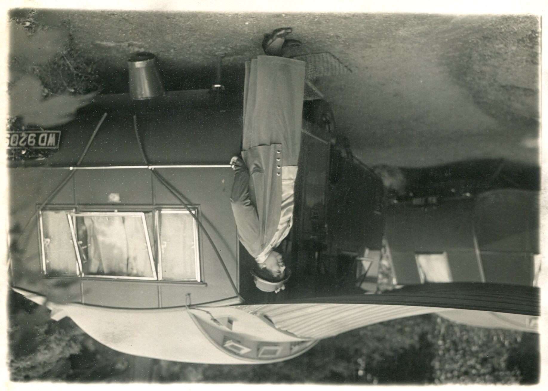 Mrs Fowler next to one of her Eccles Blue Caravans, 1930s