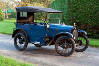 A 1928 Austin Seven Tourer vintage car in the grounds at Beaulieu