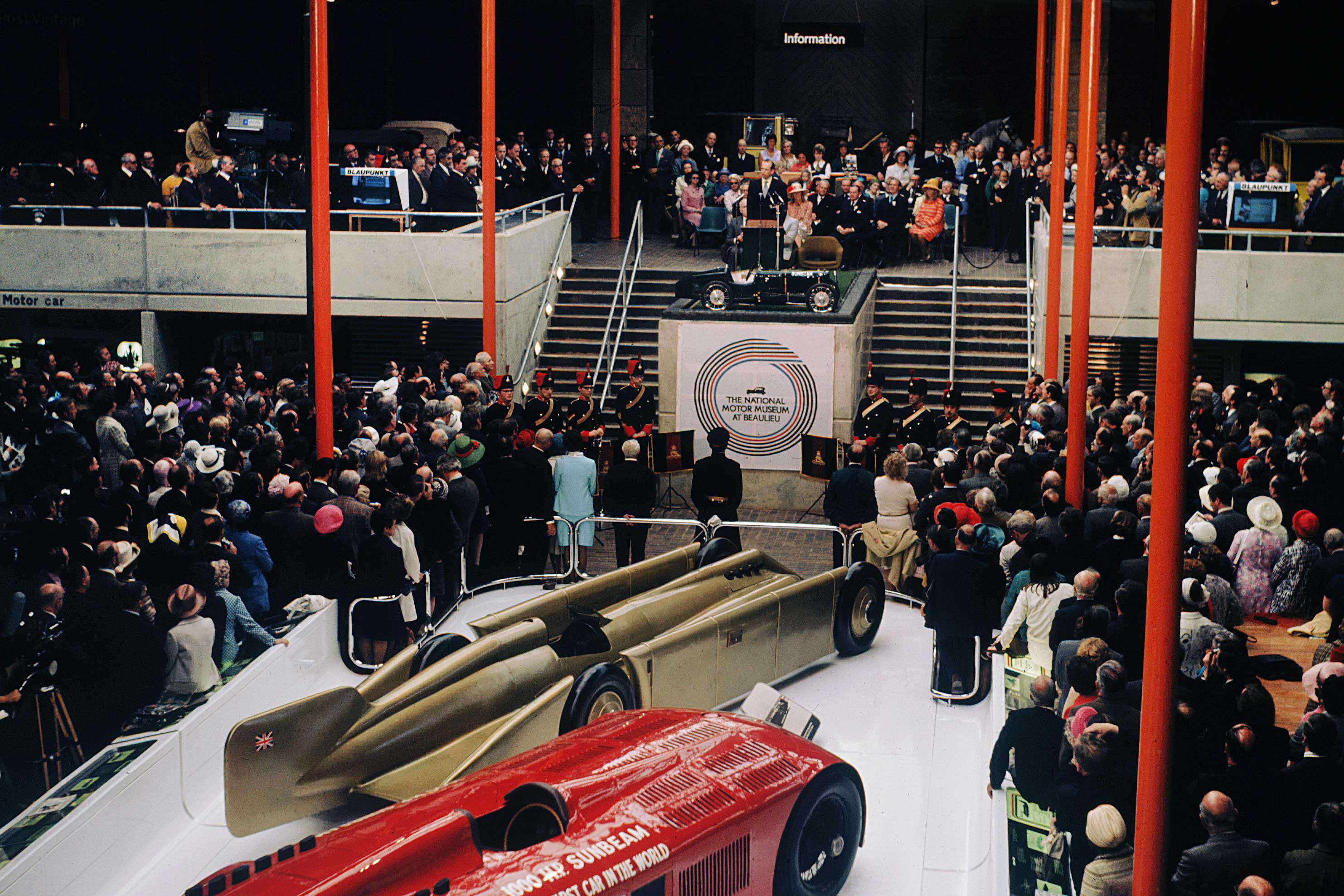 Opening of the National Motor Museum, 1972, large crowds inside museum being addressed by HRH Duke of Kent