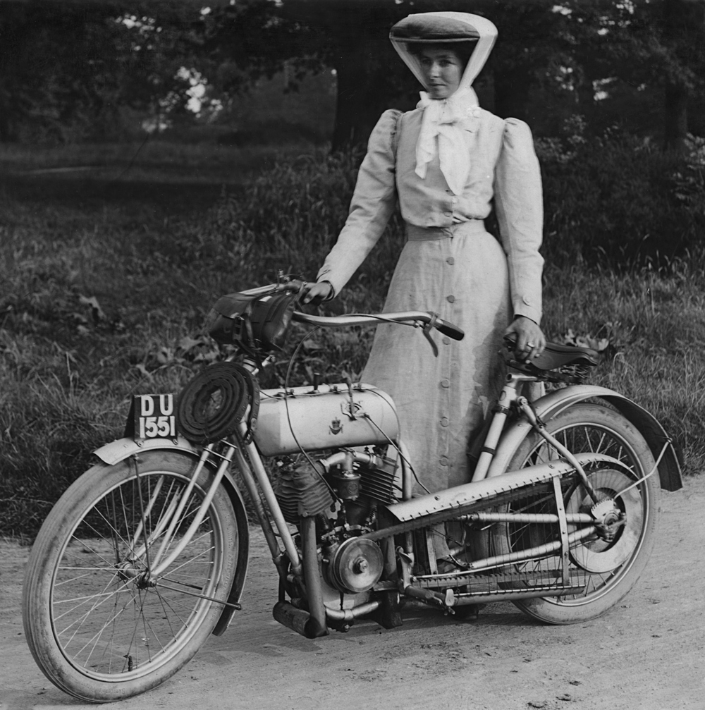 Miss Muriel Hind standing by her Rex motorcycle in 1906